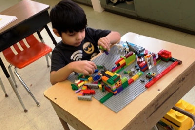 kid playing lego